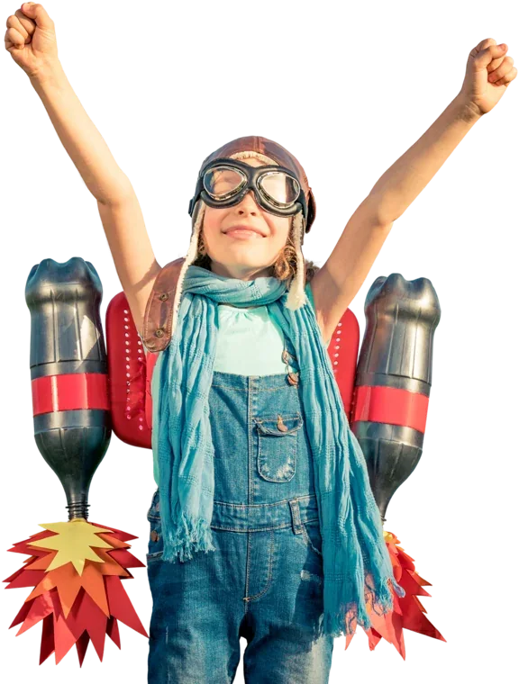 A child wearing a cardboard jetpack, arms raised