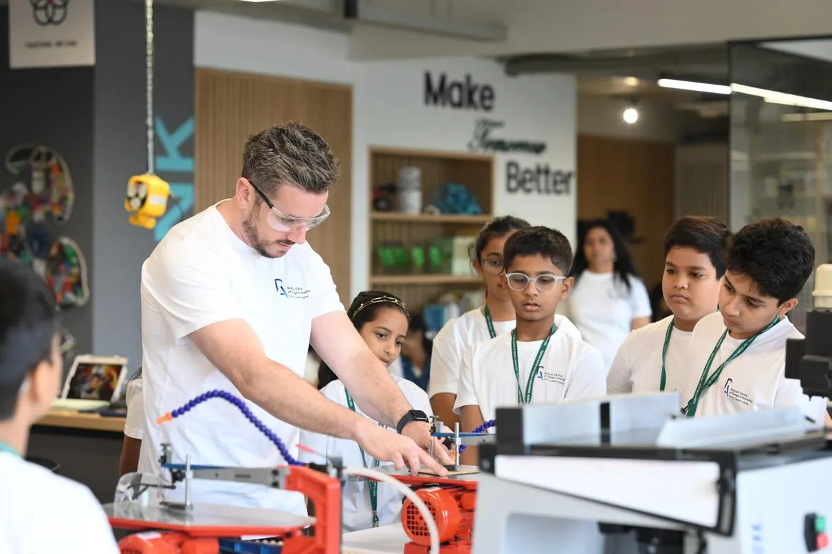 Students building a prototype with a facilitator