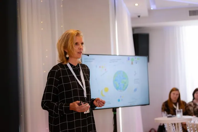 A speaker presenting at the forum